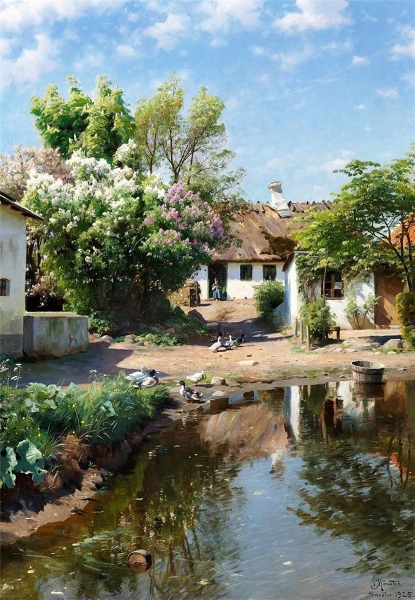 Spring day at a thatched house with blooming lilacs